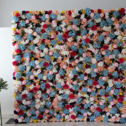 mixed colors of roses and hydrangeas and pink lasagna flowers and green leaves cloth roll up flower wall fabric hanging curtain plant wall event party wedding backdrop