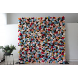 mixed colors of roses and hydrangeas and pink lasagna flowers and green leaves cloth roll up flower wall fabric hanging curtain plant wall event party wedding backdrop