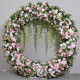 pink and white roses with green leaves double-sided floral wedding arch backdrop including frame